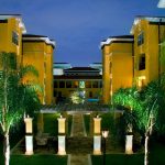 luxury apartment exterior with palm trees