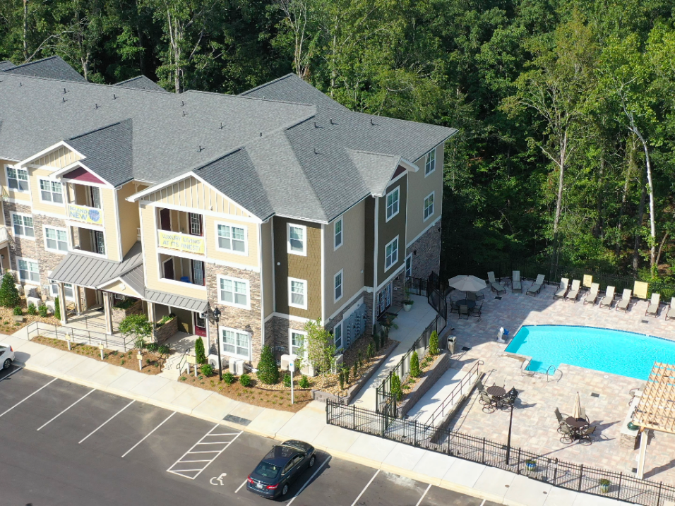 vmc-aerial-pool-website-1 aerial view of apartment building with pool